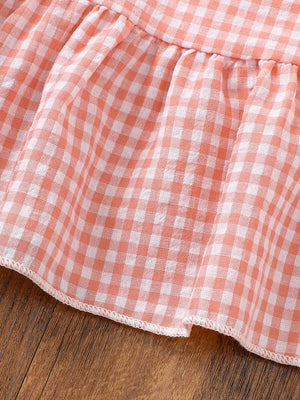 Baby gingham ruffle detail in pink cotton fabric