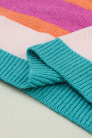 Rainbow stripe knit sweater with teal ribbed trim and balloon sleeves.