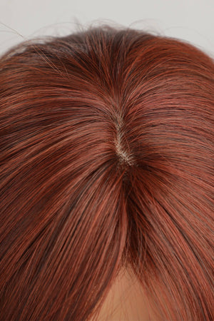 Layered copper red synthetic wig showing natural-looking scalp detail