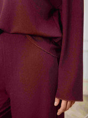 Burgundy ribbed knit lounge set with wide-leg pants and long sleeves.