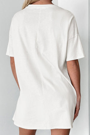 White cotton oversized tee dress with short sleeves and a relaxed fit.