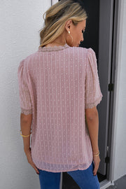 Dusty pink dotted swiss blouse with lace trim on neckline and sleeves.