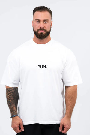 Oversized white graphic tee with black statement logo and short sleeves.