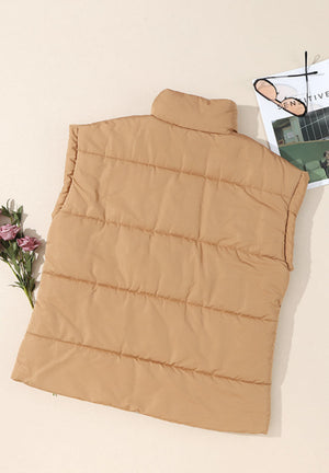 Padded tan sleeveless hooded vest with a high collar and horizontal quilting.