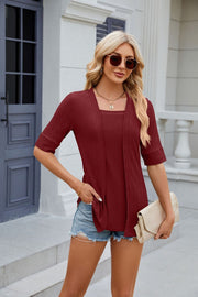 Burgundy textured layered square neckline blouse with short sleeves.
