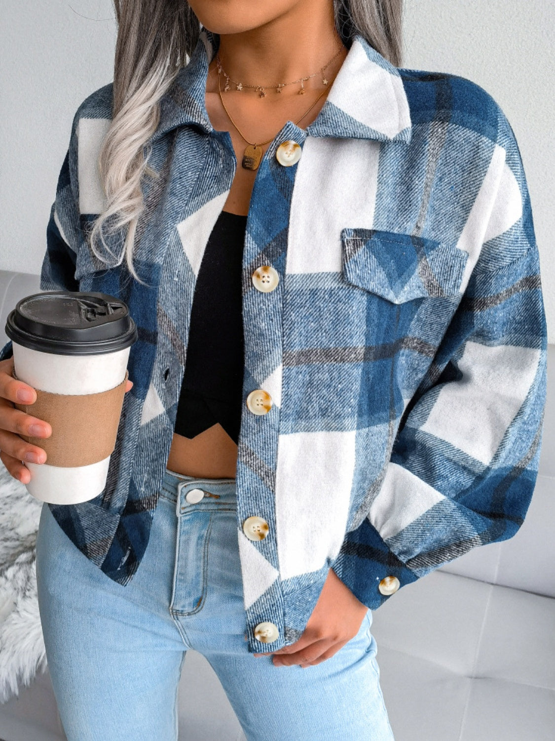 Oversized blue tartan shacket with patch pockets and button front.