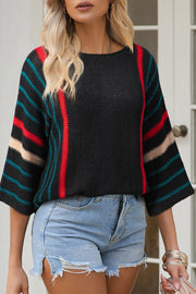 Black knit pullover with colorblock stripe sleeves and neckline detail