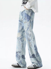 Men's light blue wide-leg jeans with distressed patchwork denim detail.