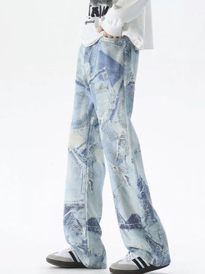 Men's light blue wide-leg jeans with distressed patchwork denim detail.
