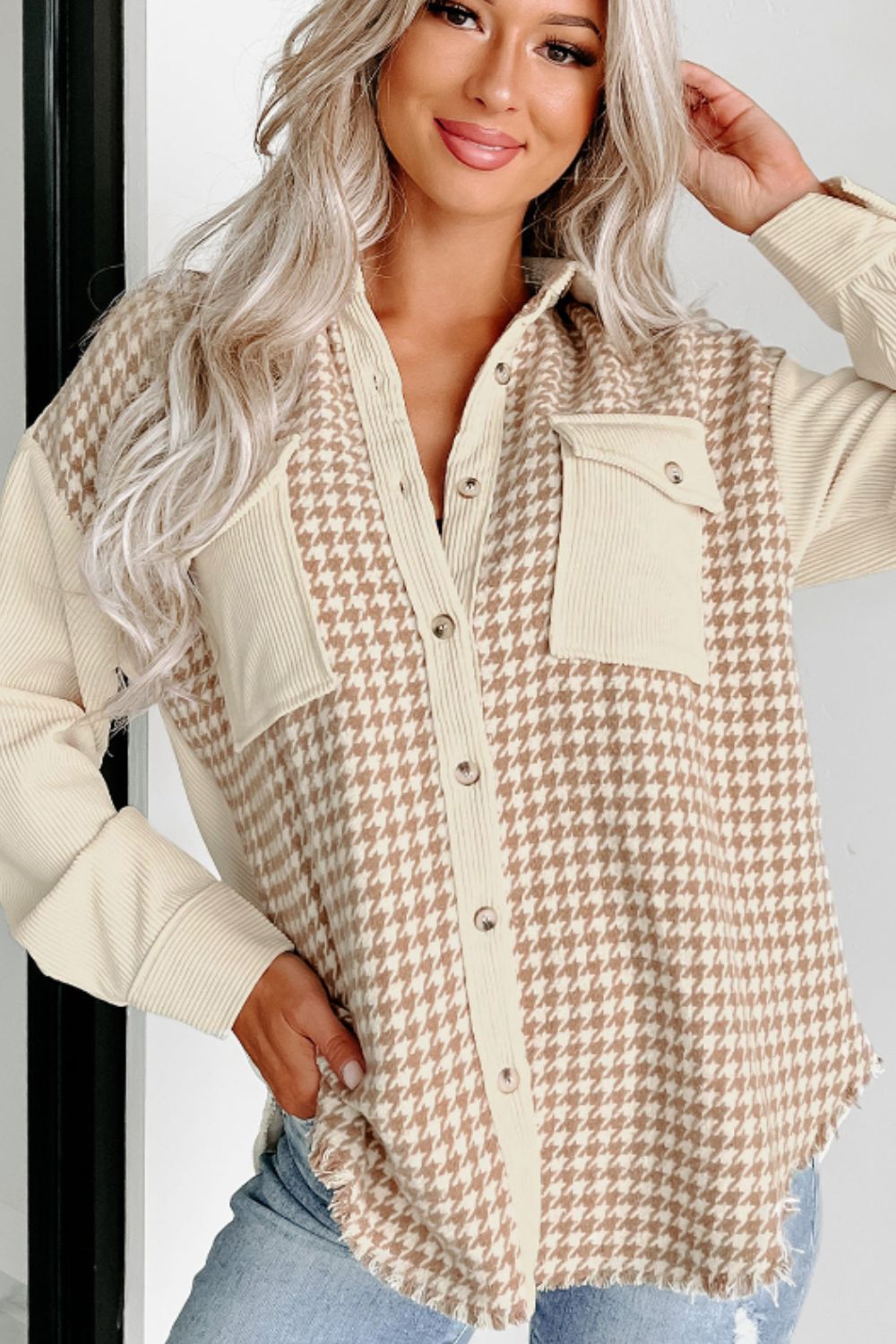 Beige houndstooth corduroy patchwork shacket with button front and chest pockets.