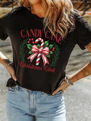 Black cotton t-shirt with Candy Cane Christmas Club graphic, featuring a candy cane and holly wreath.