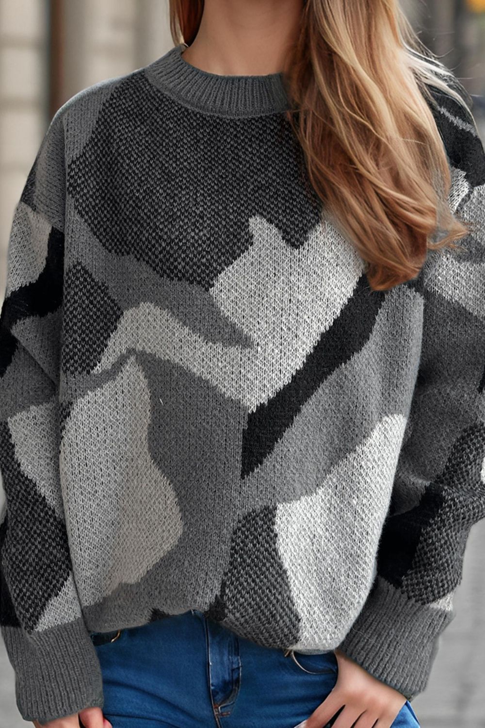 Gray geometric knit crewneck sweater with colorblock pattern.