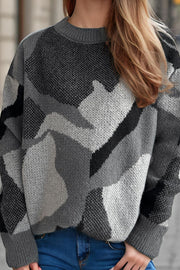 Gray geometric knit crewneck sweater with colorblock pattern.