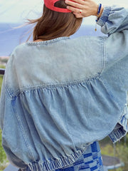 Washed denim jacket with gathered back detail and elastic cuffs.