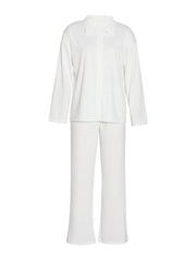 White ribbed knit loungewear set with buttoned collared shirt and relaxed fit pants.