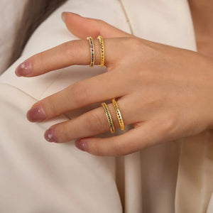 Double band rings with pavé dark green and multicolor stones and etched patterns.