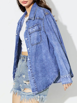 Acid wash denim overshirt in medium blue with two chest pockets and button front.