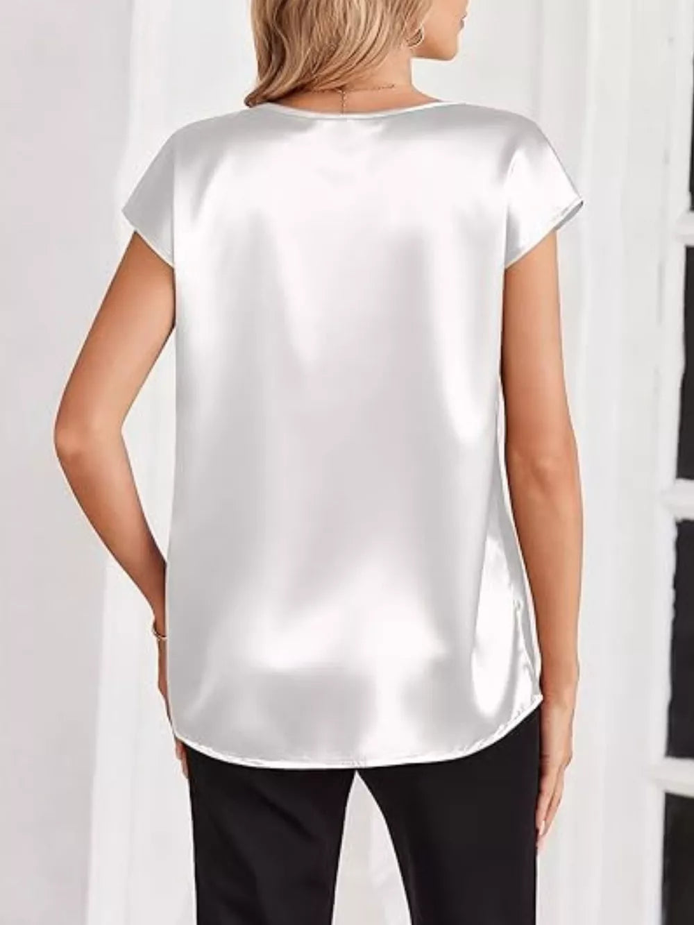 White satin V-neck short sleeve maternity shirt with a relaxed fit.
