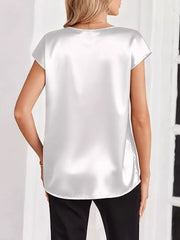 White satin V-neck short sleeve maternity shirt with a relaxed fit.