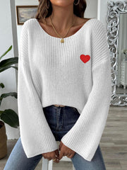 White slouchy boatneck knit sweater with embroidered red heart detail.