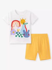 Children's white graphic t-shirt with cartoon rainbow, sun, pear, flower, bunny and checkered print, paired with yellow