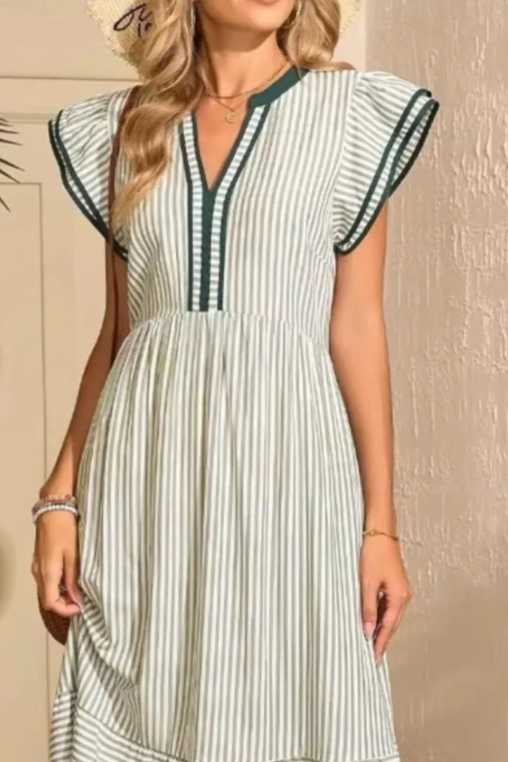 Moss striped midi dress with ruffle sleeves and V-neck with contrast trim.