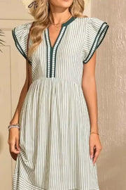 Moss striped midi dress with ruffle sleeves and V-neck with contrast trim.