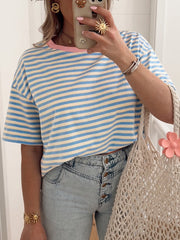 Striped round-neck t-shirt in light blue and cream cotton with pink trim.