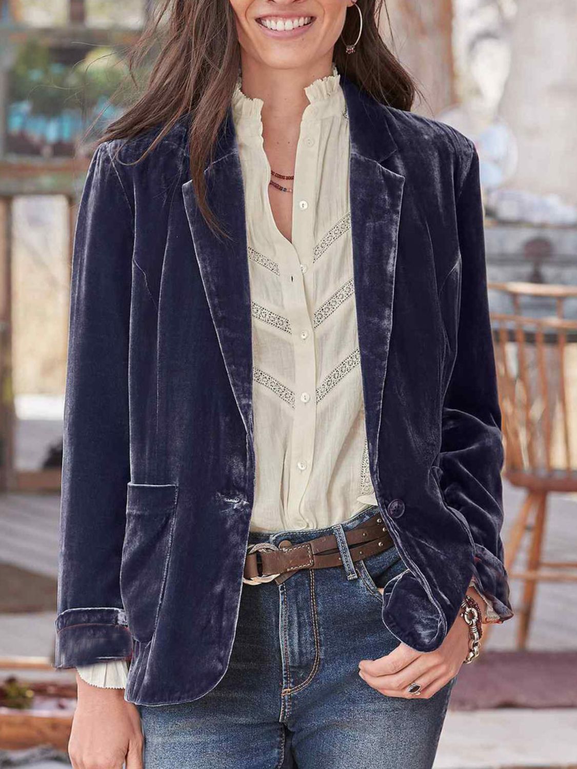 Velvet blazer in peacock blue with rolled cuff detail and buttoned front.