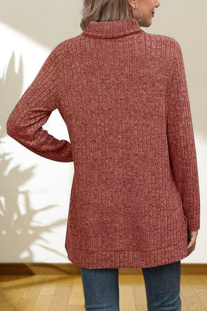 Ribbed knit turtleneck tunic top in Red Orange with long sleeves and a relaxed fit.