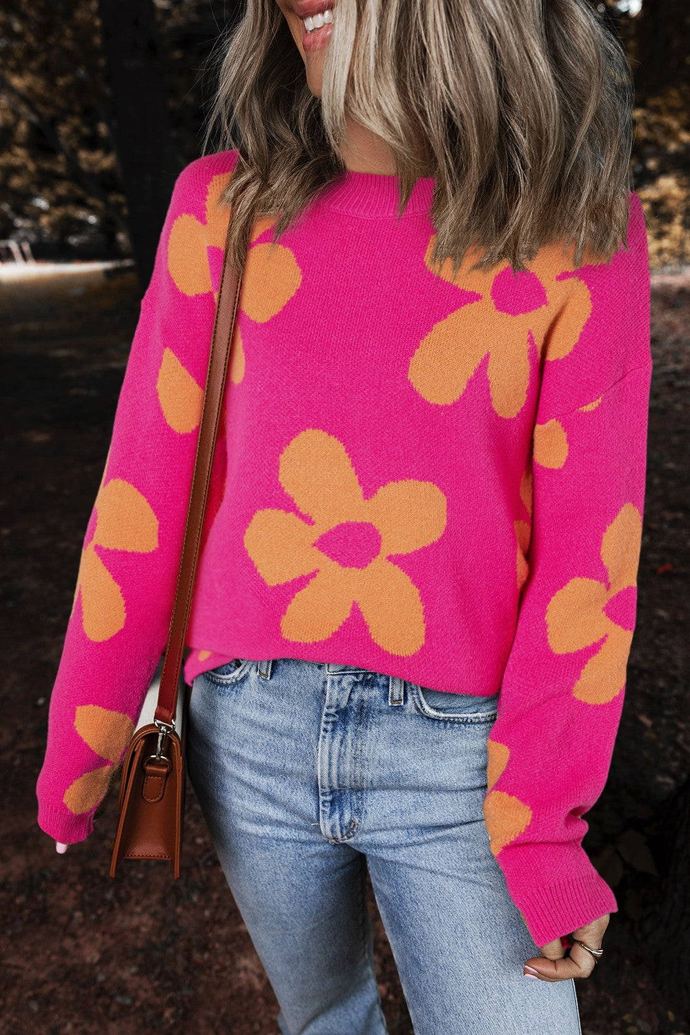 Oversized knit sweater in cerise with orange retro floral pattern, crewneck, long sleeves.