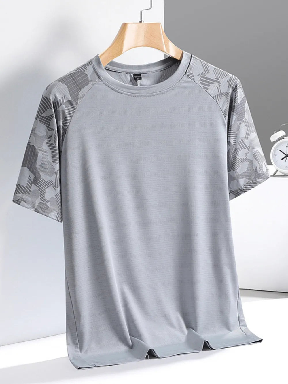 Men's grey activewear t-shirt with patterned sleeves and crew neck.