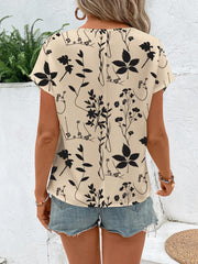 Beige botanical print round neck t-shirt with short sleeves.