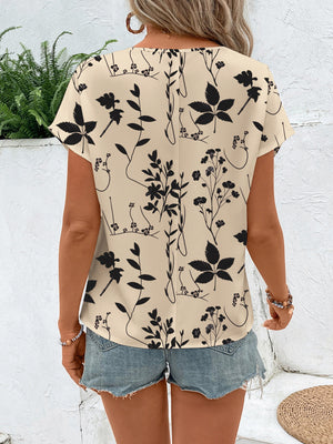 Beige botanical print round neck t-shirt with short sleeves.