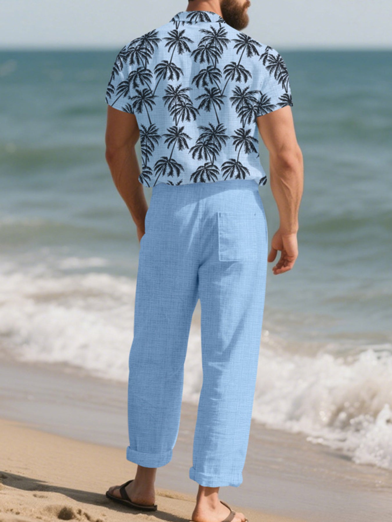 Men's relaxed fit pants in pastel blue with a textured weave, cuffed hem, and back pocket.