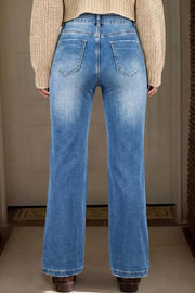 Acid-washed denim straight-leg jeans with distressed pockets and frayed hem