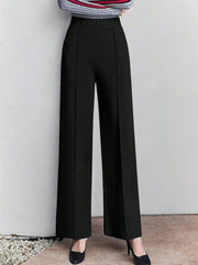 Black high-waisted wide leg cotton trousers with pockets and front seams.
