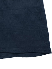 Navy ruched midi dress with textured fabric and hem detail.