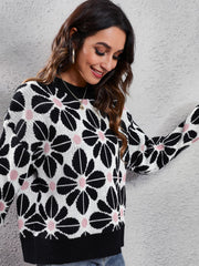 Black floral jacquard knit sweater with pink accents, crew neck, and long sleeves.