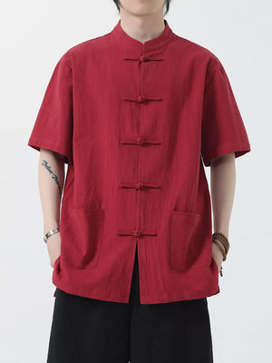 Red cotton short-sleeve shirt with mandarin collar and frog button closure, two chest pockets.