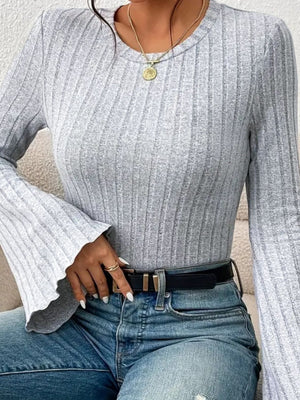 Gray ribbed knit top with scalloped cuffs and long sleeves.