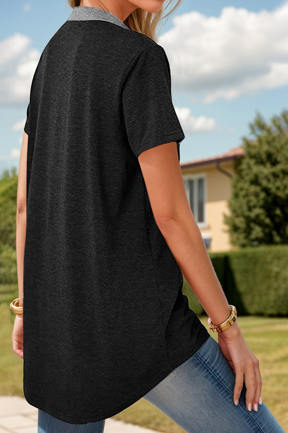 Contrast Henley Tee with patch pocket in dark gray with a light gray collar and buttons.