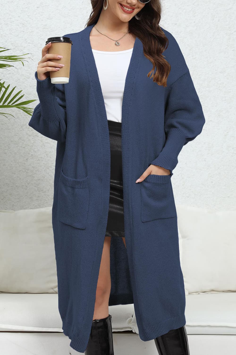 Dark Blue oversized pocketed knit cardigan with open front and long sleeves.