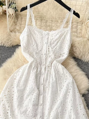 White lace-embroidered cami dress with tiered skirt and button front