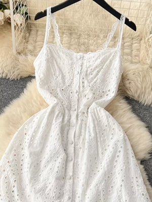 White lace-embroidered cami dress with tiered skirt and button front