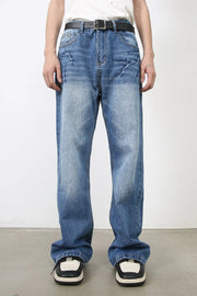 Baggy denim jeans in medium wash with distressed details and a relaxed fit.