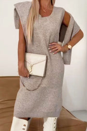 Cozy knit midi dress and matching shrug in mocha, with a relaxed fit and shoulder detail.