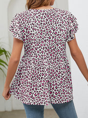 Pink leopard print babydoll blouse with flutter sleeves and cinched waist.
