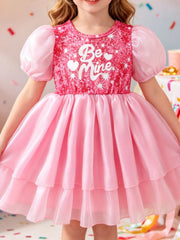 Pink sequin baby dress with puff sleeves and "Be Mine" graphic, tiered skirt