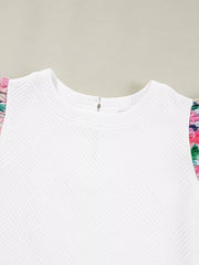White geometric knit top with floral ruffled sleeves